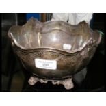 A silver bowl with scroll feet by Garrard & Co., B