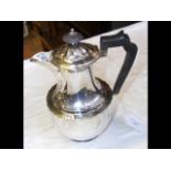 A silver water jug with Sheffield hallmark - 21cm