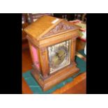 An antique oak cased bracket clock with chime in s