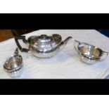 A three-piece silver teaset with London hallmark a