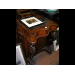 A Victorian mahogany Davenport desk with drawers t