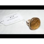 A 1910 gold half sovereign coin in gold mount