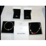 A Pandora bracelet, together with three other piec