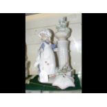 A large Lladro figure of girl wearing bonnet