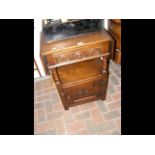 An Ipswich oak drop-leaf side table with cupboard