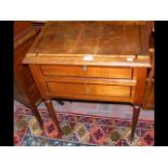 An antique inlaid worktable on turned tapering sup