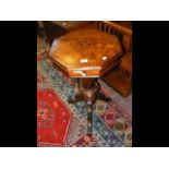 A Victorian walnut 'trumpet' sewing table