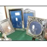 Four silver photo frames