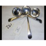 A pair of silver sauce ladles with London hallmark