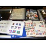 Four albums containing collectable stamps from aro