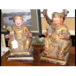 A pair of 28cm high carved wooden painted deity fi