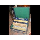 A vintage Alvari accordion in case
