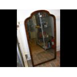 Antique walnut framed shaped mirror