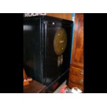 A black lacquered oriental antique cupboard with l