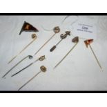 Selection of various stickpins, including sailing