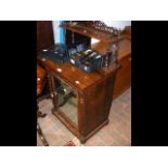 A mid Victorian rosewood chiffonier with shelf to