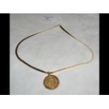 An 1871 gold sovereign coin on 9ct gold chain