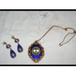 A lady's elegant enamel and gilt pendant on chain,