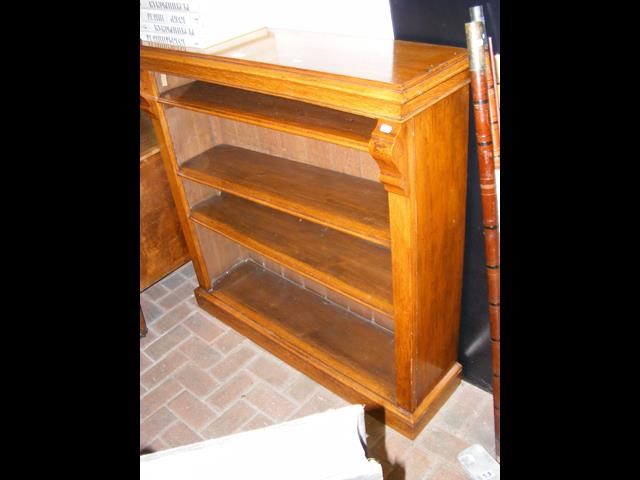 A Victorian oak open bookcase with three shelves -