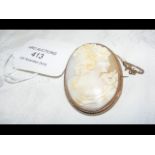 Decorative Cameo brooch in yellow metal setting