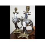 A pair of unusual candlesticks fashioned from swor
