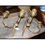 A pair of decorative gilt and metal wall candelabr