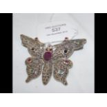 A silver 'butterfly' brooch set with rubies and em