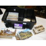 A plastic box containing approx. 1,000 postcards -