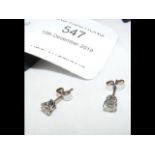 A pair of diamond stud earrings - approx. 0.45 car