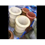 Two old terracotta chimney pots and two others