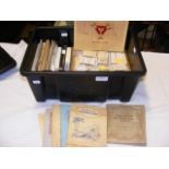 A plastic box containing cigarette cards in sets a