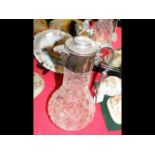 A silver mounted cut glass claret jug with London