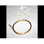 A lady's 15ct gold bangle