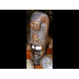 A carved wooden African head - 40cm high