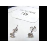 A pair of diamond stud earrings - approx. 1.06 car