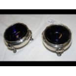 A pair of George II silver cauldron salts with blu