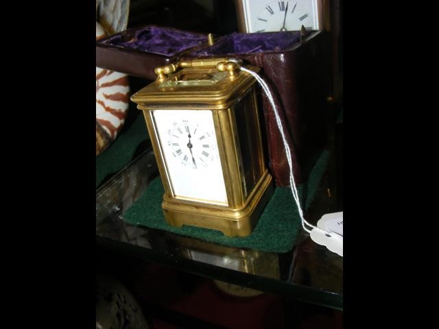 A miniature brass cased carriage clock - 8cm high
