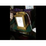 A miniature brass cased carriage clock - 8cm high