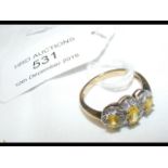 A lemon quartz and diamond ring in gold setting