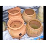 Two terracotta pots, together with two terracotta