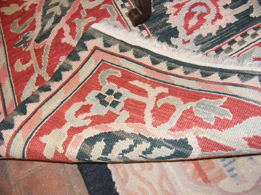 A large Middle Eastern style carpet with geometric - Image 2 of 6