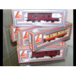 Seven boxed Lima rolling stock