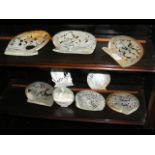 A collection of nine old carved oyster shells