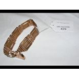 A lady's 9ct gold bracelet with heart clasp