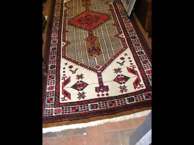 A Middle Eastern rug with geometric border - 225cm