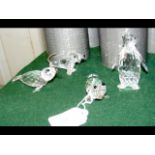 Four boxed Swarovski animal ornaments, including a