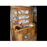 A large antique pine dresser with plate rack and c