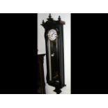 A three train antique Vienna style wall clock