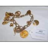 A 9ct gold charm bracelet, including 1878 gold sov