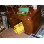 Antique pedestal desk with red leather top